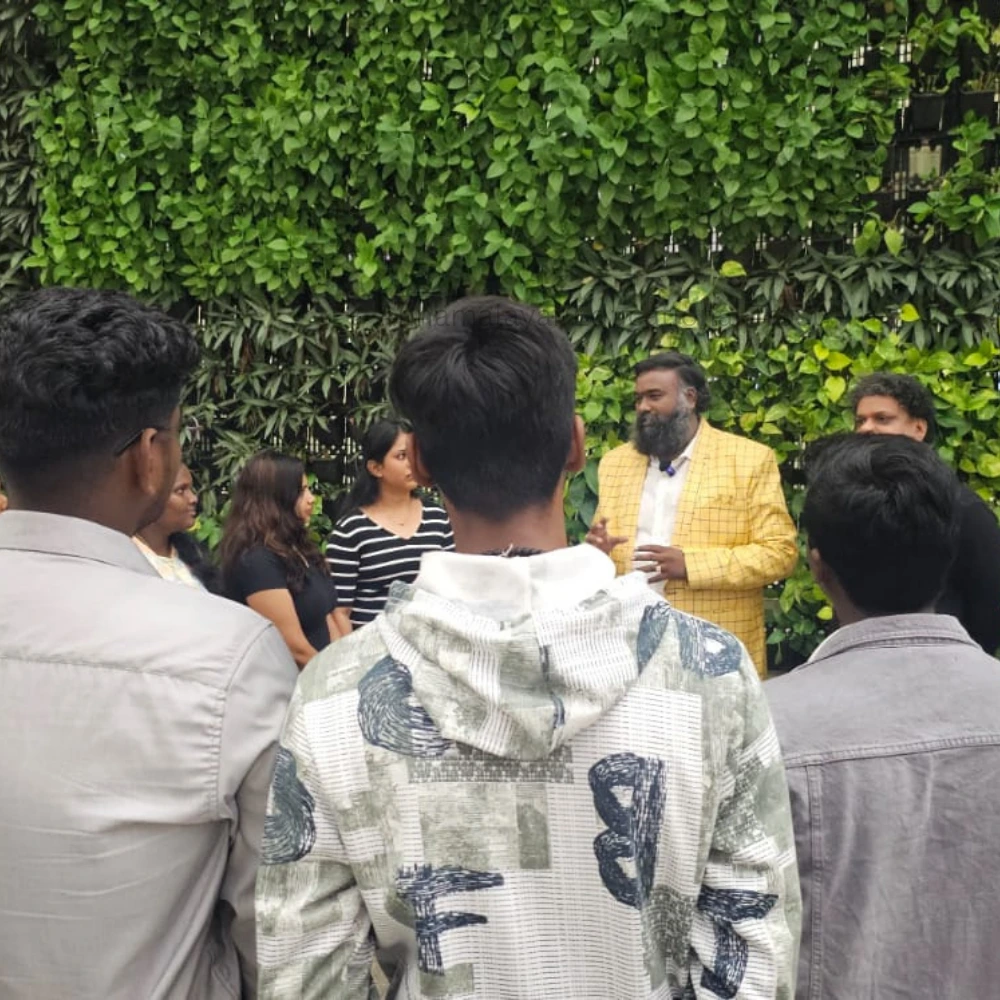 Founder R N Madhan Kumar talking to MBBS students at the airport and guiding them before their Uzbekistan journey by Annamalayar Educational Trust