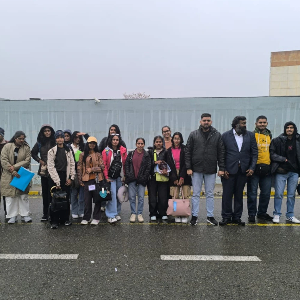 Indian MBBS students standing at a recognised foreign medical university campus before returning to Become a Doctor in India - Annamalayar Educational Trust